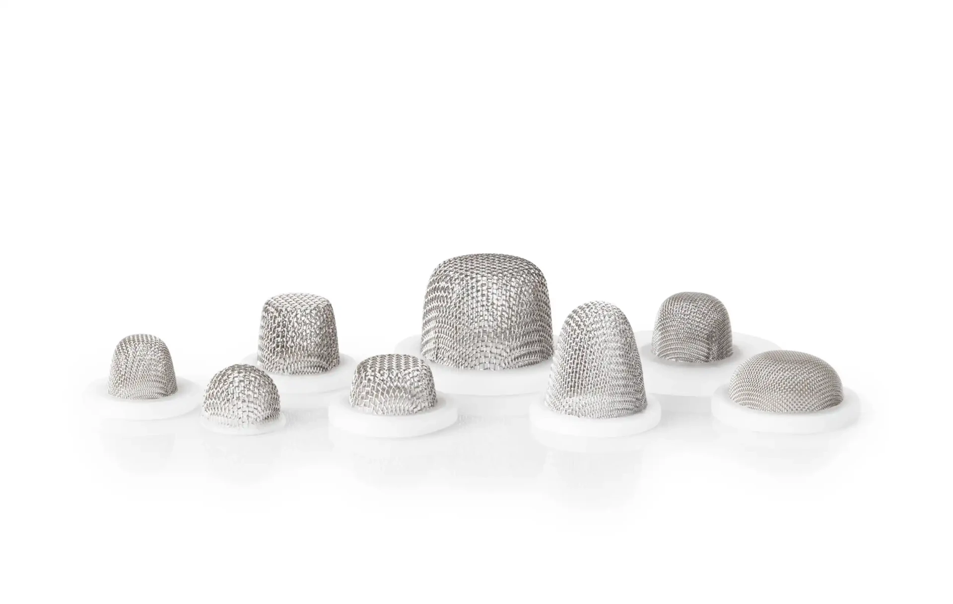 Small stainless steel mesh caps on white plastic bases